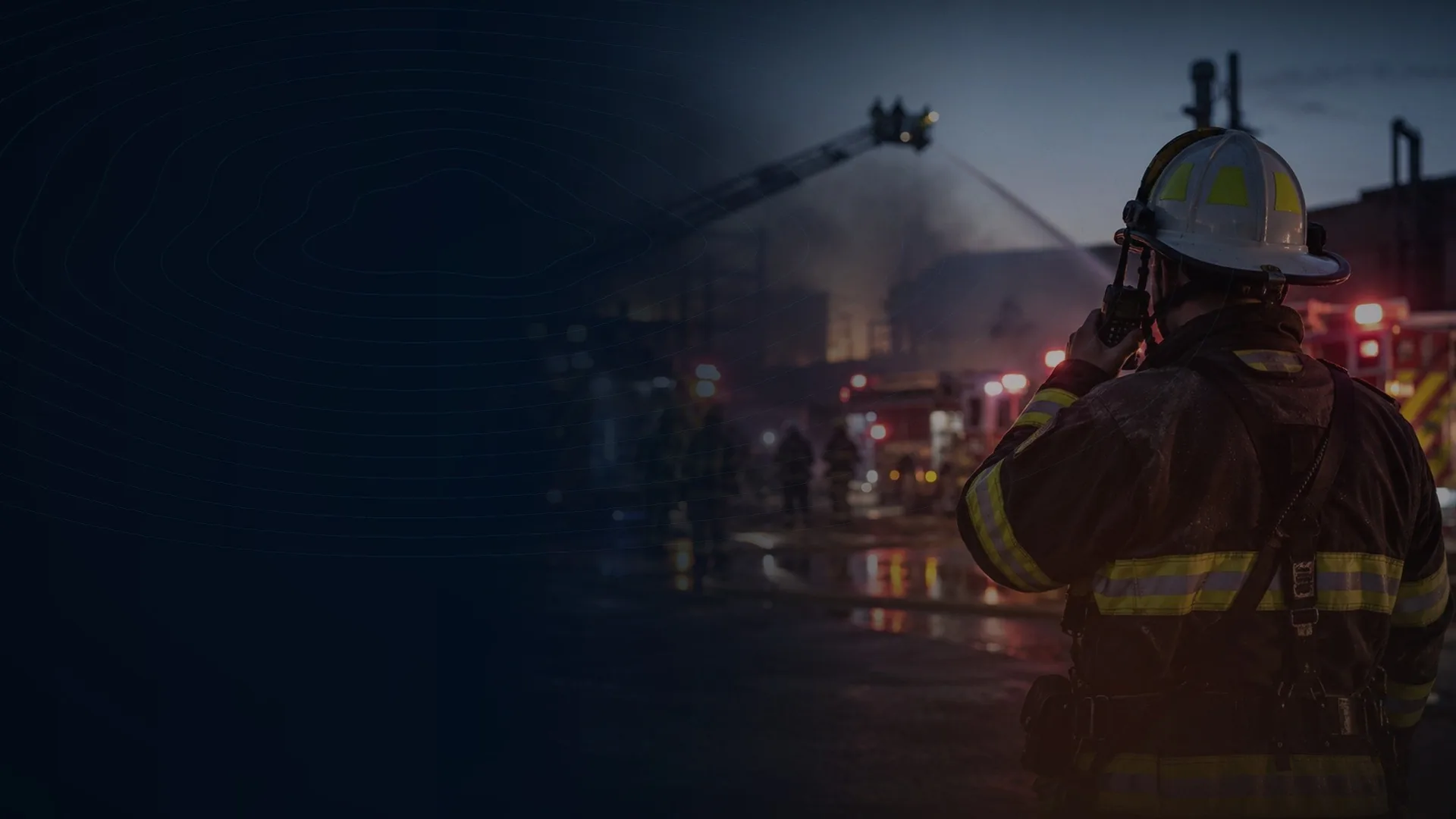Firefighters responding to an emergency scene at night